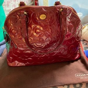 Cranberry red satchel handbag by Coach